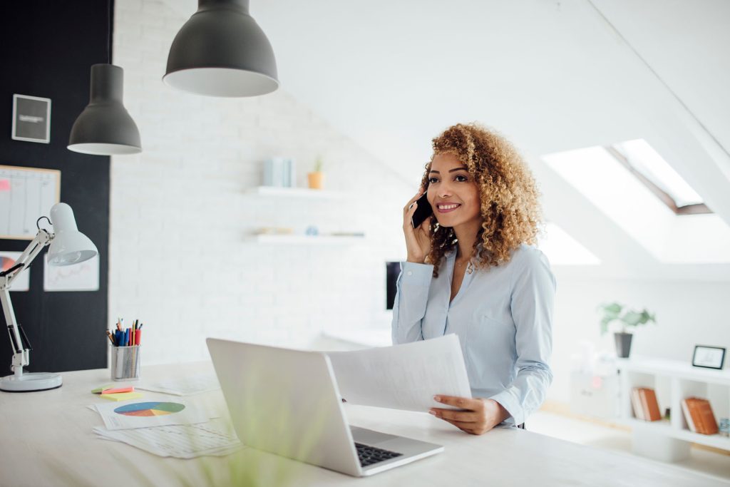 Latina Businesswoman Working In Her Office